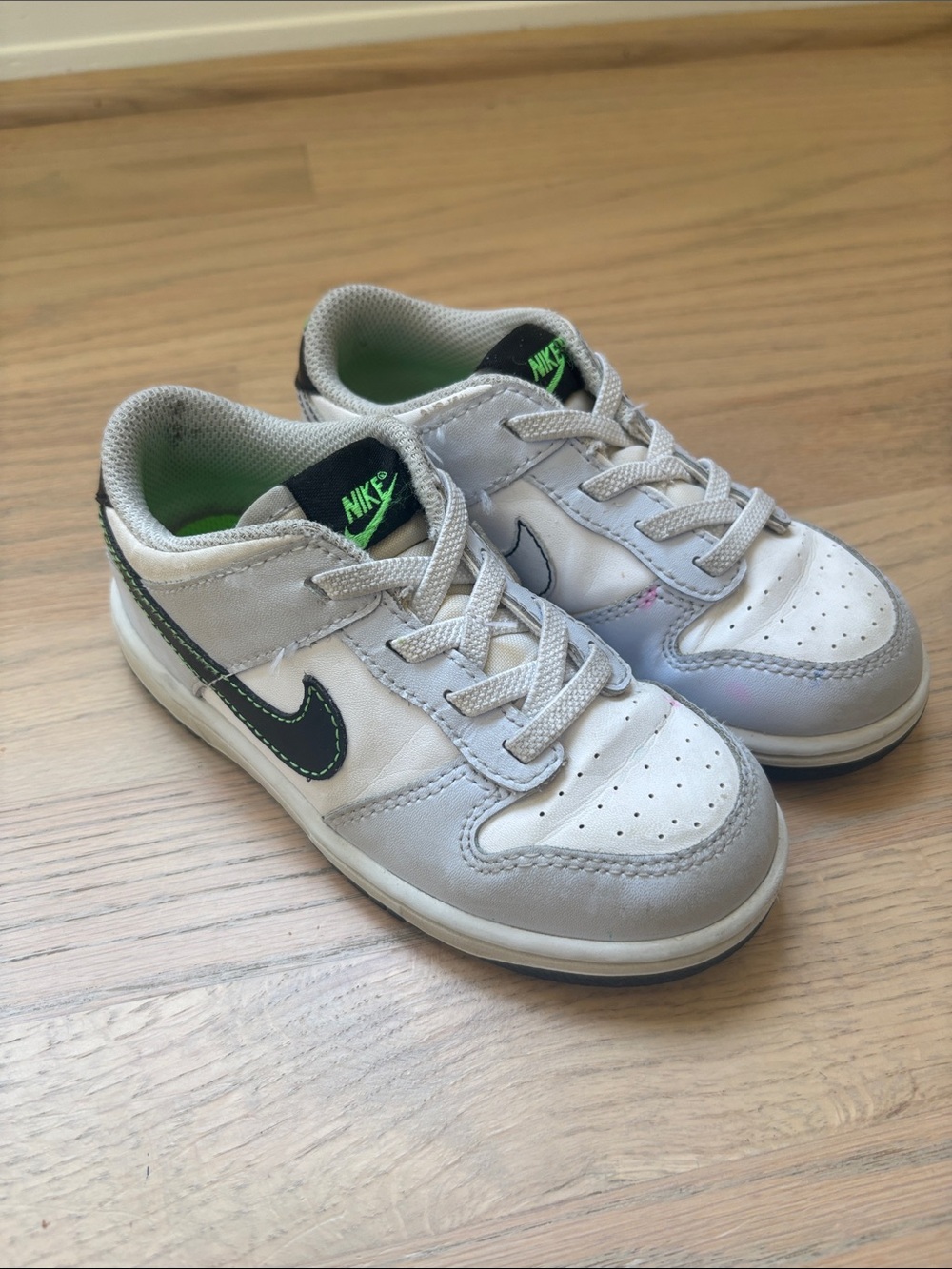 Nike Kids Dunks Low -White and Gray Sneakers with Black Swoosh and Green Accents